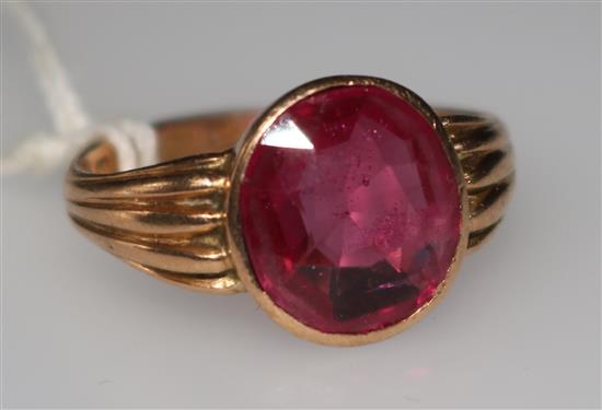 A 15ct gold and synthetic ruby ring, size R.